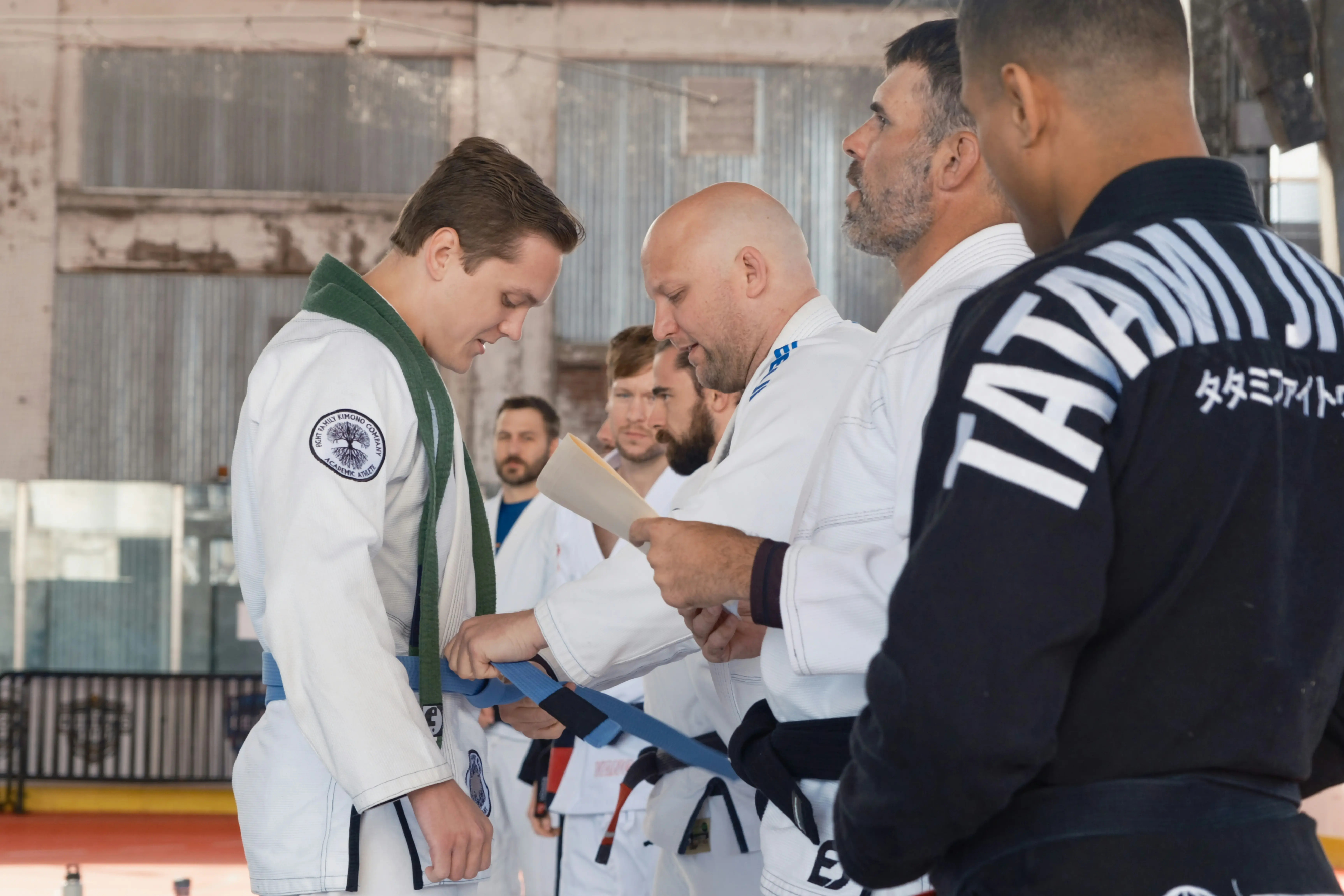 Zachary receiving his BJJ blue belt